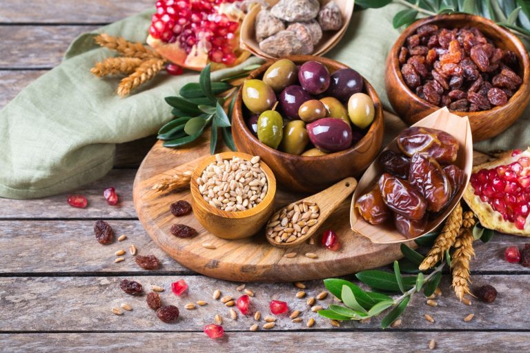 Tu Bishvat holiday symbols - dried fruits, pomegranate, barley, wheat